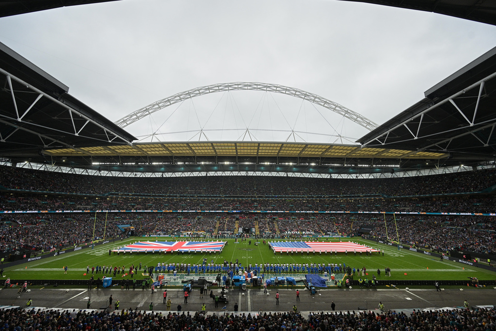 A general view of the flags of Britain and the United States on the field of Wembley stadium before an NFL football game between the Los Angeles Rams and the Jacksonville Jaguars in London, Sunday, Oct. 19, 2025. (AP Photo/Anthony Upton)