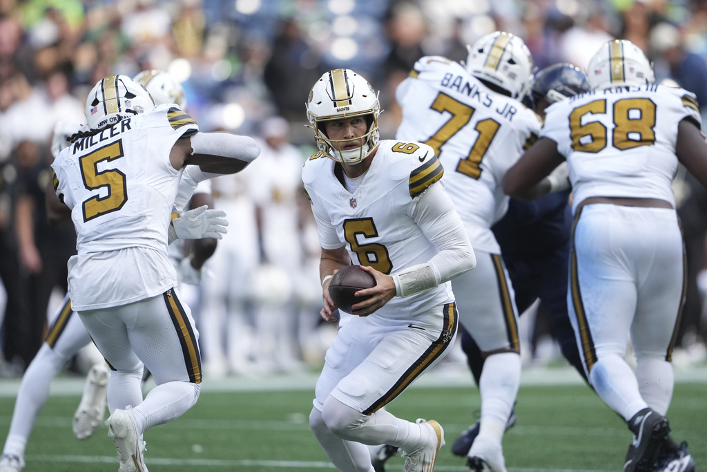 New Orleans Saints quarterback Tyler Shough (6) drops back in the second half of an NFL football game against the Seattle Seahawks, Sunday, Sept. 21, 2025, in Seattle. (AP Photo/Lindsey Wasson)