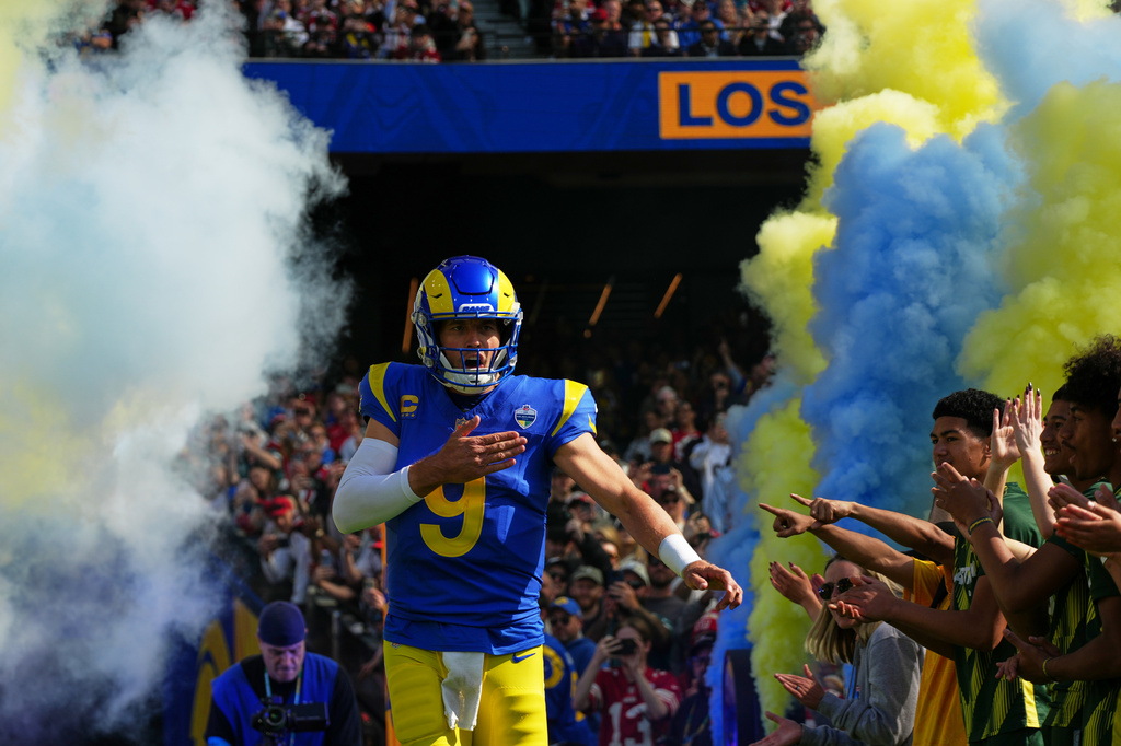 Los Angeles Rams quarterback Matthew Stafford runs onto the field before an NFL football game between the Los Angeles Rams and the San Francisco 49ers, Friday, Sept. 11, 2026, in Melbourne, Australia. (AP Photo/Asanka Brendon Ratnayake)