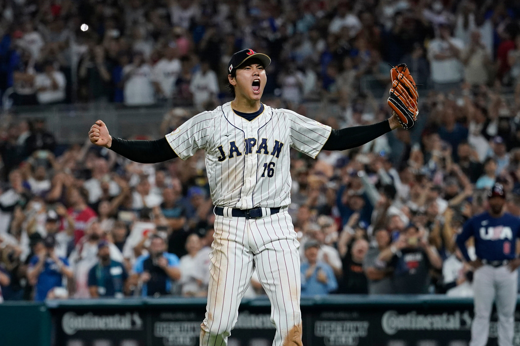 FILE - Japan pitcher Shohei Ohtani (16) celebrates after defeating the United States in the championship game of the World Baseball Classic, Tuesday, March 21, 2023, in Miami. (AP Photo/Marta Lavandier, File)