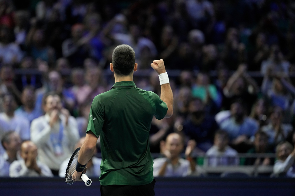 Novak Djokovic of Serbia celebrates after winning a set against Alejandro Tabilo of Chile during the ATP tournament round of 16 tennis match, in Athens, Greece, Tuesday, Nov. 4, 2025. (AP Photo/Petros Giannakouris)