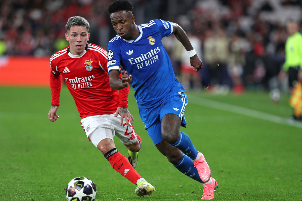 FILE - Benfica's Gianluca Prestianni fights for the ball against Real Madrid's Vinicius Junior during a Champions League playoff soccer match between SL Benfica and Real Madrid in Lisbon, Portugal, Tuesday, Feb. 17, 2026. (AP Photo/Pedro Rocha, File)