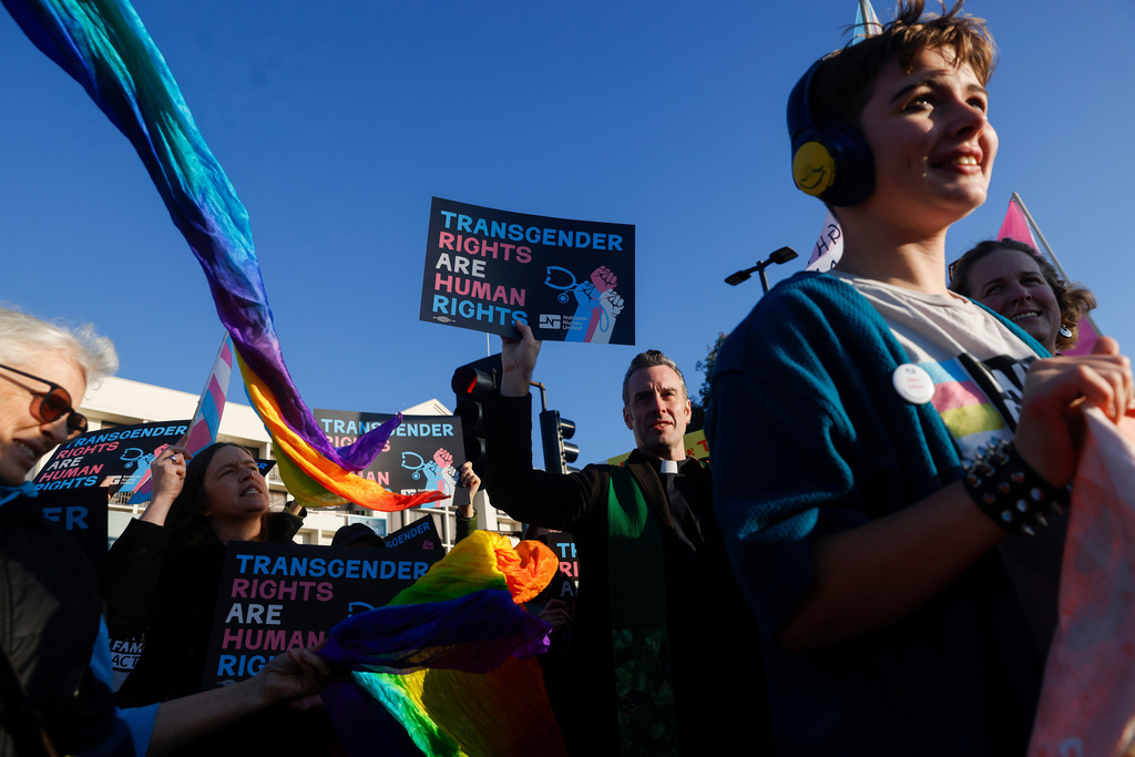 FILE - Members of Rainbow Families Action march from Bay Street to the Sutter corporate offices on Powell Street in Emeryville, Calif., Dec. 8, 2025, to protest the end of gender-affirming care to patients under age 19. (Jessica Christian/San Francisco Chronicle via AP, File)