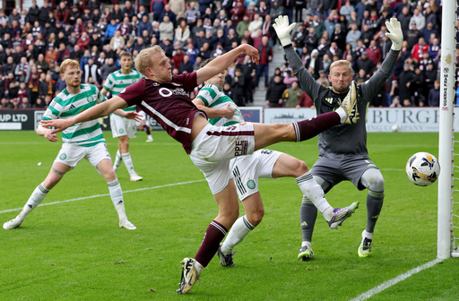 Heart of Midlothian's Harry Milne has a shot on goal during the Scottish Premiership soccer match between Heart of Midlothian and Celtic, at Tynecastle Park, in Edinburgh, Sunday, Oct. 26, 2025. (Steve Welsh/PA via AP) Heart of Midlothian's Harry Milne has a shot on goal during the Scottish Premiership soccer match between Heart of Midlothian and Celtic, at Tynecastle Park, in Edinburgh, Sunday, Oct. 26, 2025. (Steve Welsh/PA via AP)