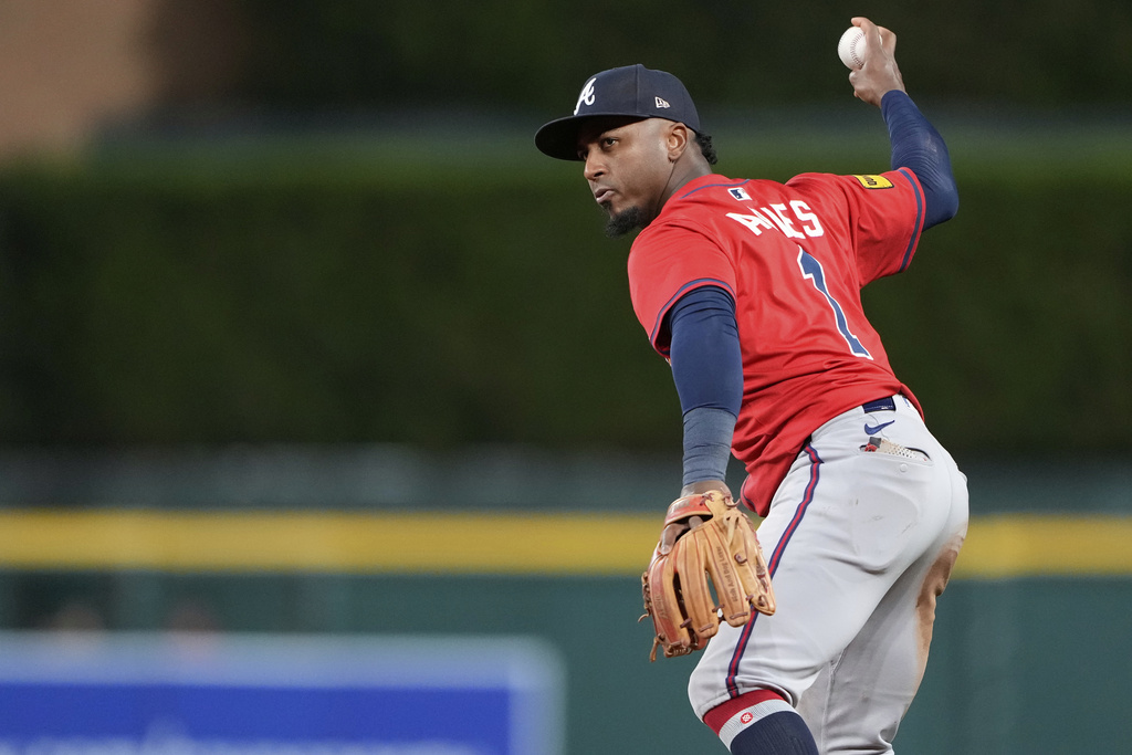 Atlanta Braves second baseman Ozzie Albies prepares to throw out Detroit Tigers' Parker Meadows at first base during the sixth inning of a baseball game, Friday, Sept. 19, 2025, in Detroit. (AP Photo/Ryan Sun)