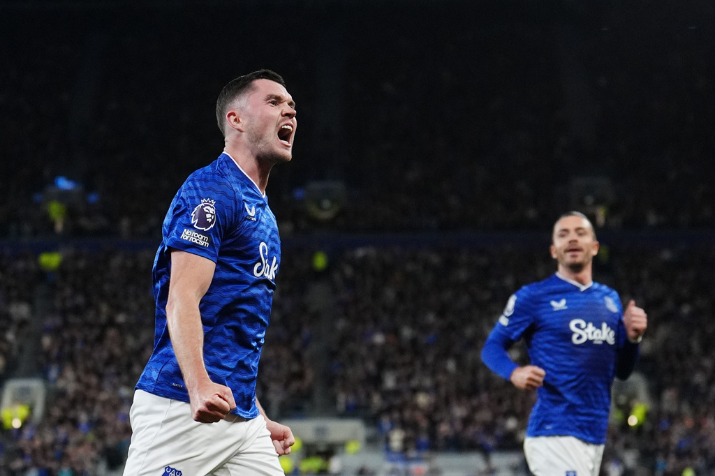 Everton's Michael Keane, left, celebrates after scoring the opening goal during the English Premier League soccer match between Everton and West Ham United at the Hill Dickinson Stadium, Liverpool, England, Monday, Sept. 29, 2025. (Martin Rickett/PA via AP)
