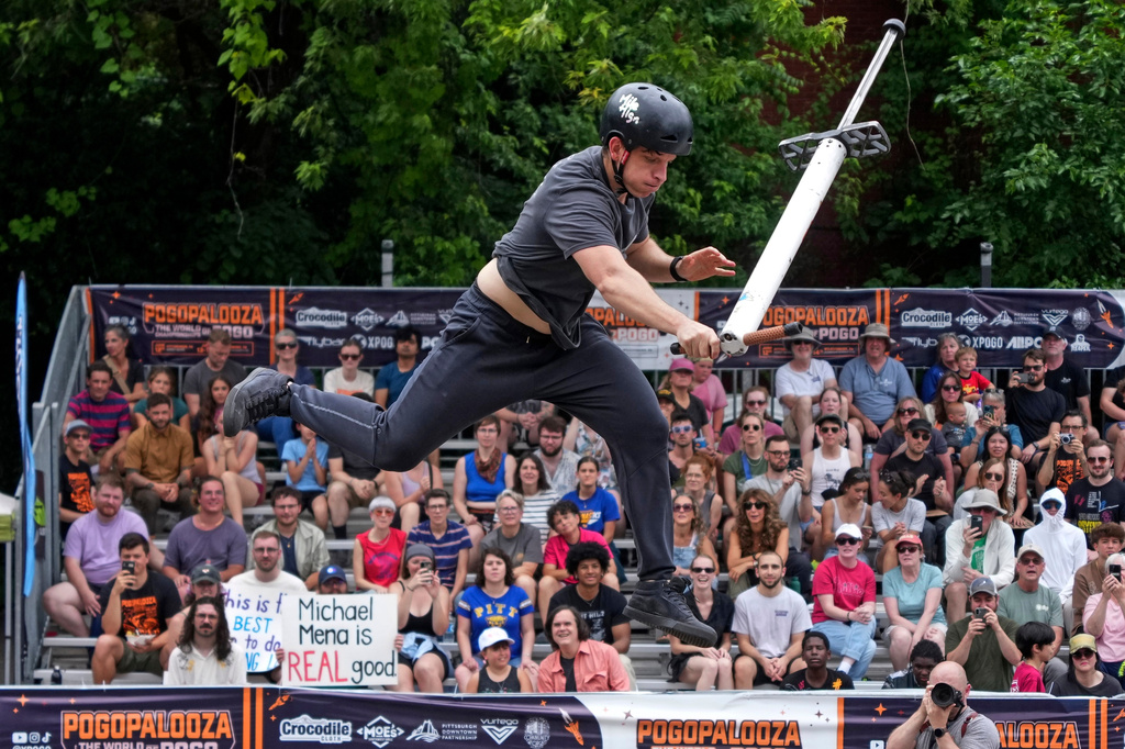 Extreme pogo athlete Michael Mena performs during his first place effort during the Big Air competition at Pogopalooza 2026 in Wilkinsburg, Pa., Sunday, June 14, 2026. (AP Photo/Gene J. Puskar)