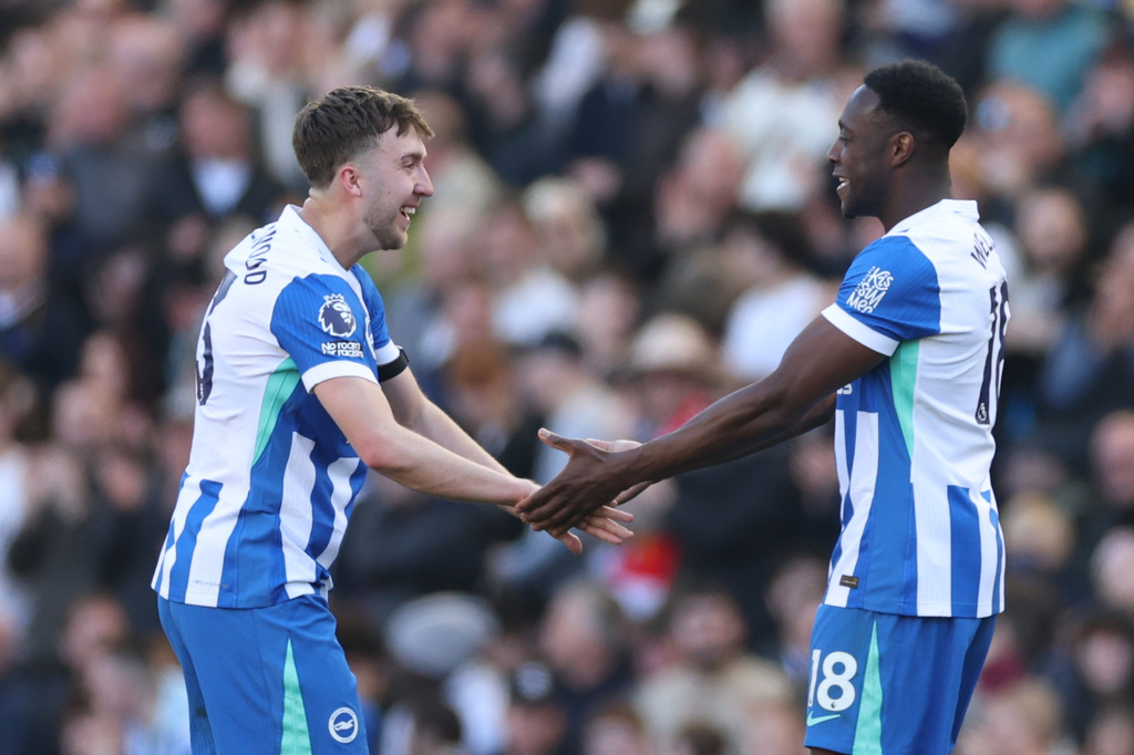 Brighton's Jack Hinshelwood, left, and Danny Welbeck celebrate after a goal during the English Premier League soccer match between Brighton and Liverpool in Brighton, Saturday, March 21, 2026. (AP Photo/Ian Walton)