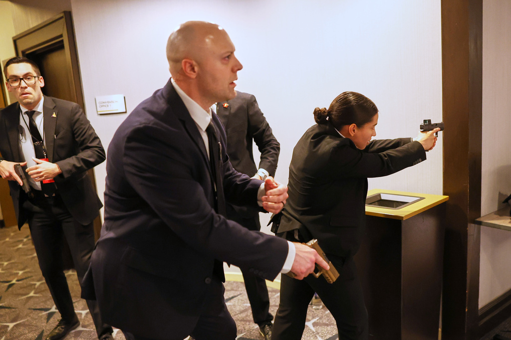 Members of law enforcement respond during the White House Correspondents Dinner, Saturday, April 25, 2026, in Washington. (AP Photo/Tom Brenner)