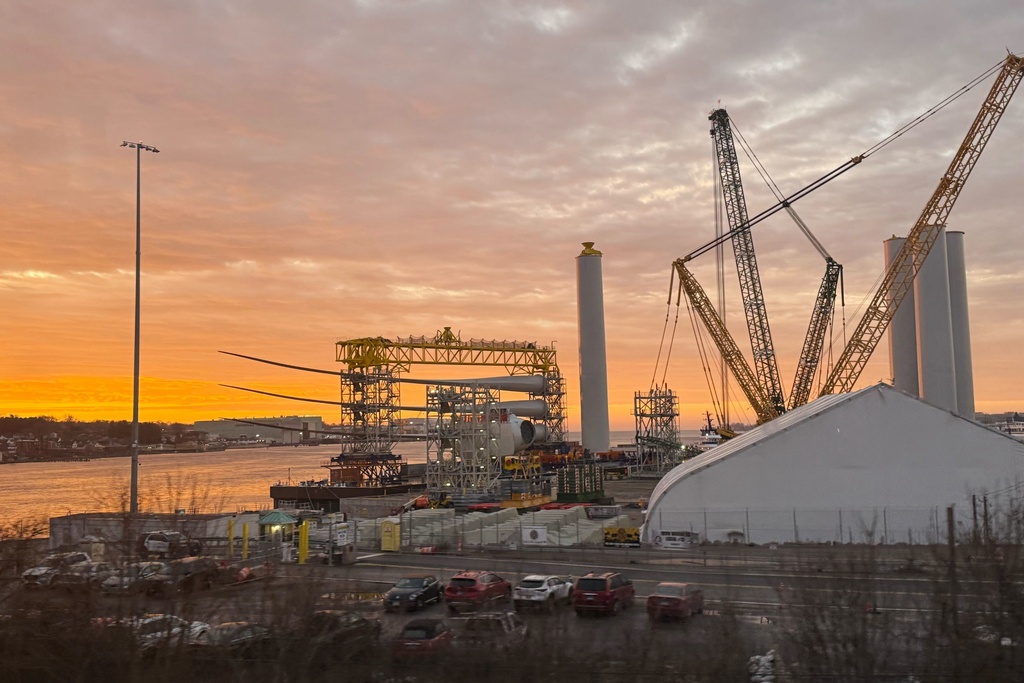 FILE - Blades and turbine bases for offshore wind sit at a staging area at New London State Pier, Jan. 14, 2026, in New London, Conn. (AP Photo/Matt O'Brien, File)