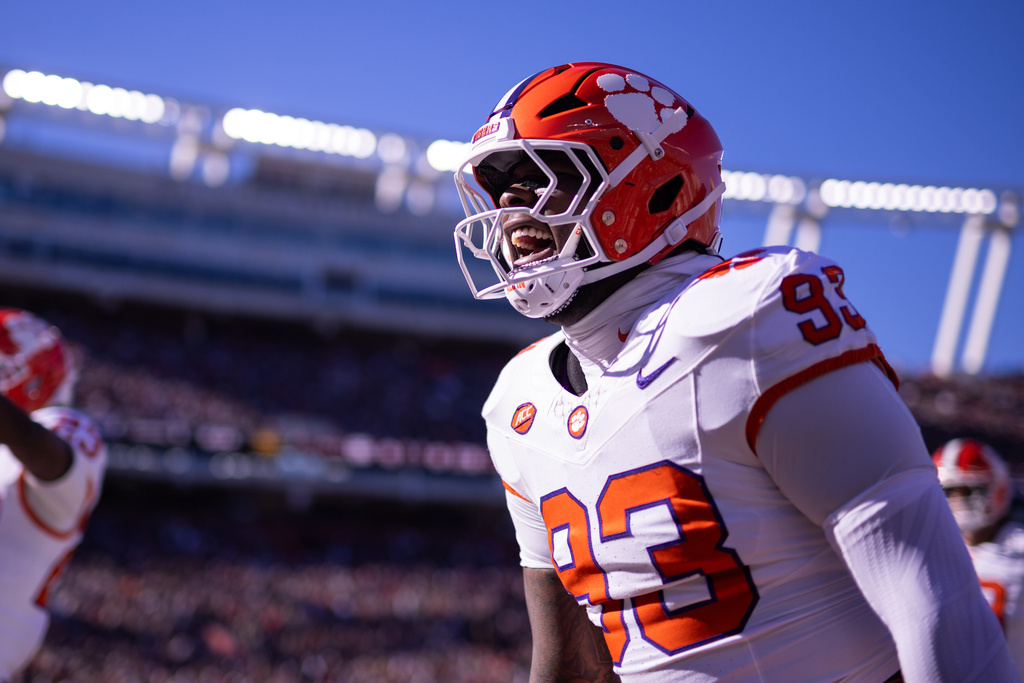 Clemson defensive lineman Caden Story (93) celebrates after an interception against the South Carolina in the first half of an NCAA college football game, Saturday, Nov. 29, 2025, in Columbia, S.C. (AP Photo/Scott Kinser)