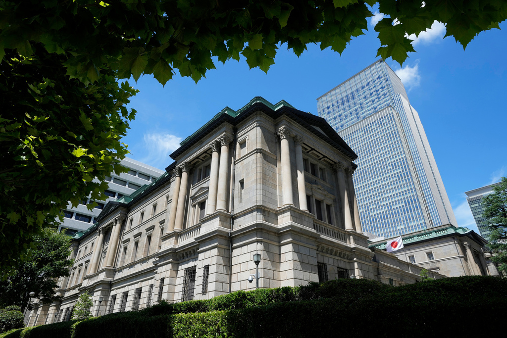 FILE - A Japanese flag flutters at the Bank of Japan headquarters in Tokyo on July 29, 2022. (AP Photo/Shuji Kajiyama, File)