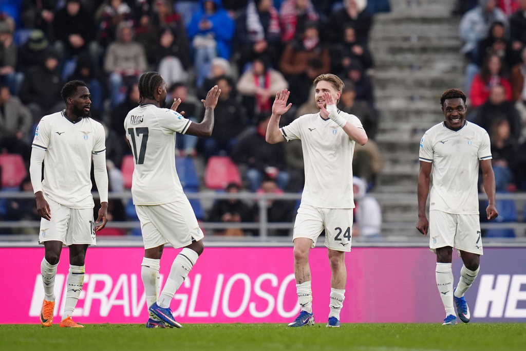 Lazio's Kenneth Taylor, second right, celebrates after scoring his side's second goal during the Serie A soccer match between FC Bologna and Lazio Rome in Bologna, Italy, Sunday, March 22, 2026. (Massimo Paolone/LaPresse via AP)