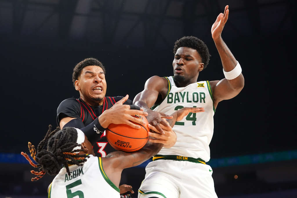 Louisville forward Sananda Fru, top left, reaches for a rebound against Baylor guards Tounde Yessoufou (24) and Obi Agbim (5) during the first half of an NCAA college basketball game Saturday, Feb. 14, 2026, in Fort Worth, Texas. (AP Photo/LM Otero)