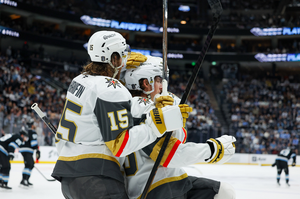 Vegas Golden Knights defenseman Noah Hanifin (15) and right wing Mitch Marner (93) celebrate a goal against the Utah Mammoth during the second period of Game 6 in the first round of an NHL hockey Stanley Cup playoff series, Friday, May 1, 2026, in Salt Lake City. (AP Photo/Melissa Majchrzak)