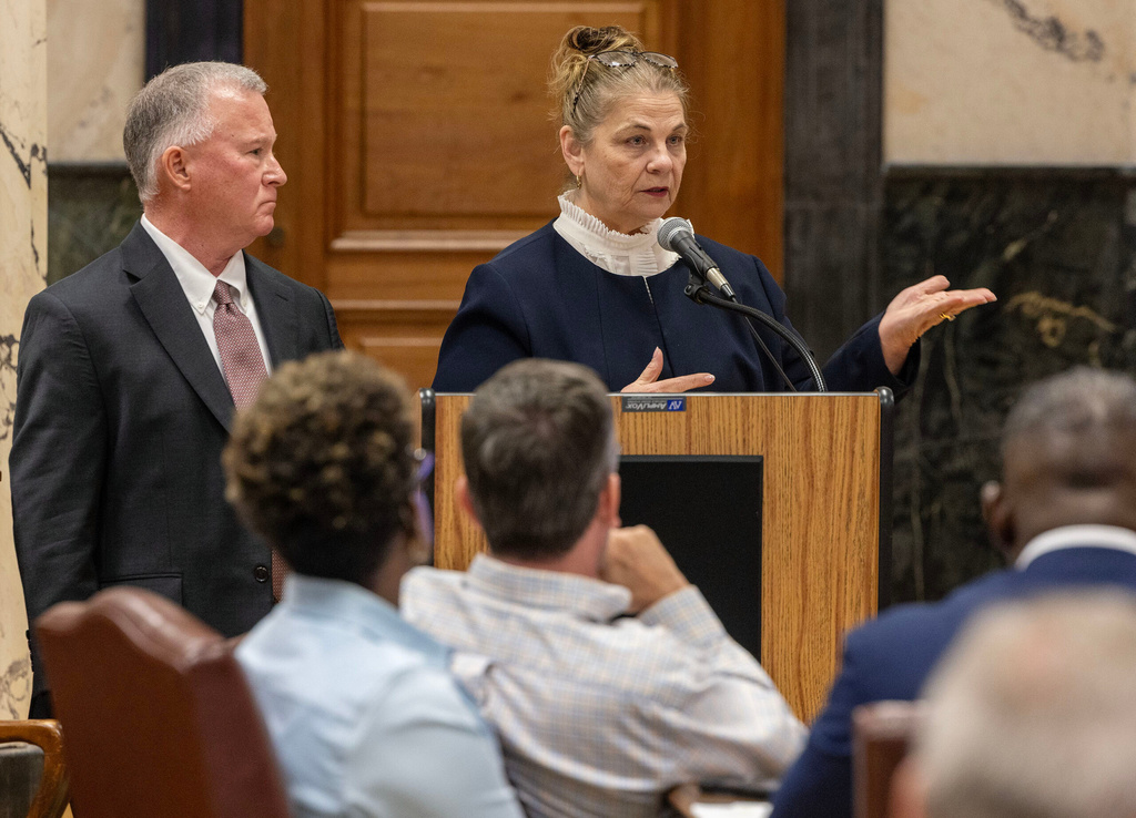 Viola Riggin, co-founder and CEO of VitalCore Health Strategies, and Bryan Collier, the company's executive operations adviser, speak to members of the Senate Public Health and Welfare Committee and the House Corrections Committee during a joint meeting at the Capitol in Jackson on Thursday, Oct. 15, 2026. (Eric Shelton/Mississippi Today via AP)