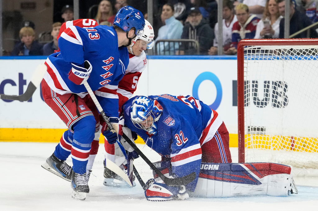 New York Rangers goaltender Jonathan Quick (32) protects the net from Detroit Red Wings center Emmitt Finnie (58) during the second period of an NHL hockey game, Saturday, April 4, 2026, in New York. (AP Photo/Yuki Iwamura)
