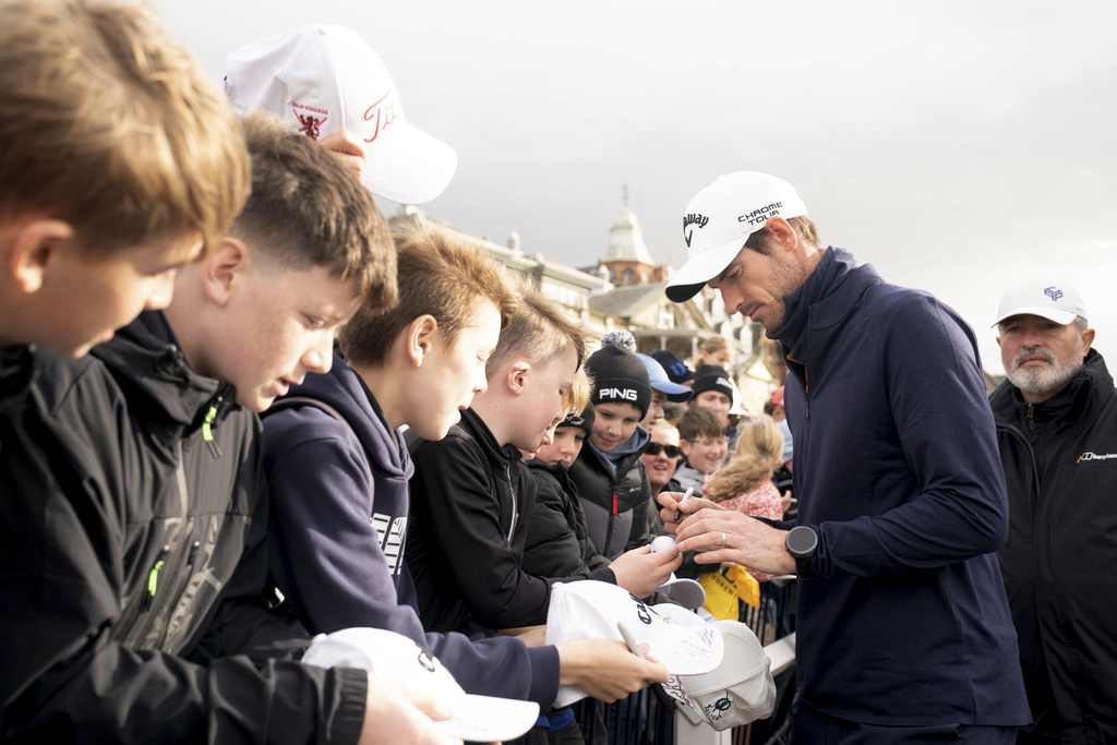 Andy Murray signs autographs following his final round during day four of the 2025 Alfred Dunhill Links Championship at the Old Course, St Andrews, Scotland, Sunday, Oct. 5, 2025. (Jane Barlow/PA via AP)