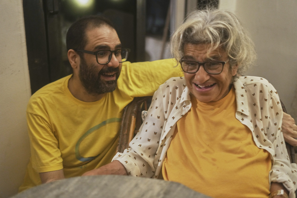 Pro-democracy activist Alaa Abd el-Fattah who was in prison for almost all of the past 12 years, hugs his mother Laila Soueif, as he arrives at his home, after a presidential pardon, in Cairo, Egypt, Tuesday, Sept. 23, 2025. (AP Photo/Amr Nabil)