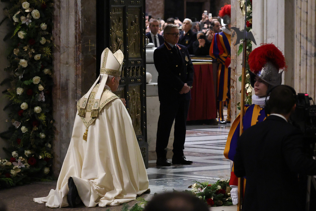 Pope Leo XIV closes St. Peter's Basilica Holy Door to end the 2025 ordinary Jubilee year, at the Vatican, Tuesday, Jan. 6, 2026. (Yara Nardi/Pool photo via AP)