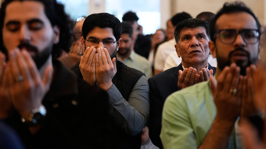 Muslim worshippers attend Eid al-Fitr prayer at the Islamic Institute of America Friday, March 20, 2026, in Dearborn Heights, Mich. (AP Photo/Paul Sancya)