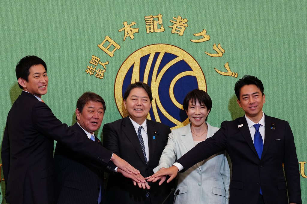 FILE - Candidates running for the Liberal Democratic Party's (LDP) leader pose for a photo as they attend its election debate at the Japan National Press Club in Tokyo, Wednesday, Sept. 24, 2025. From left are former Economic Security Minister Takayuki Kobayashi, former Secretary-General Toshimitsu Motegi, Chief Cabinet Secretary Yoshimasa Hayashi, former Economic Security Minister Sanae Takaichi and Agriculture Minister Shinjiro Koizumi. (Jia Haocheng/Pool Photo via AP, File)