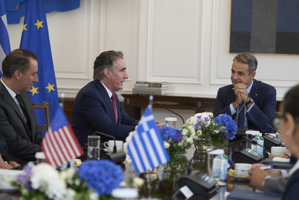U.S. Secretary of the Interior Doug Burgum, second left, speaks during a meeting with Greek Prime Minister Kyriakos Mitsotakis at the Maximou Mansion in Athens, Thursday, Sept. 11, 2025. (AP Photo/Petros Giannakouris)