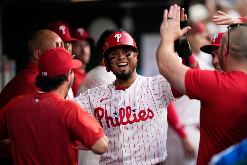 Philadelphia Phillies' Luis Arraez celebrates after scoring on a double by Brandon Marsh during the third inning of a baseball game against the Washington Nationals Tuesday, Aug. 4, 2026, in Philadelphia. (AP Photo/Matt Slocum)