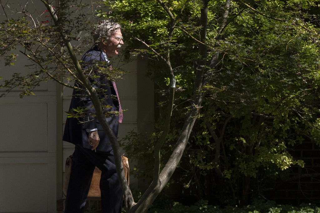 Former national security adviser John Bolton arrives at his house Friday, Aug. 22, 2025, in Bethesda, Md. (AP Photo/Manuel Balce Ceneta)