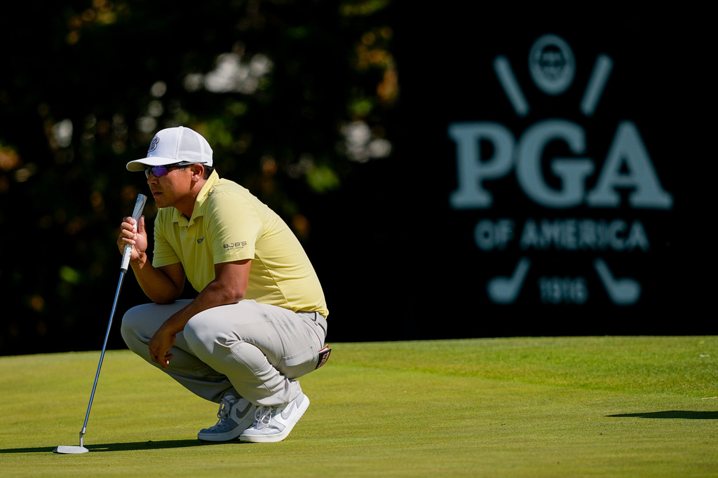 Kurt Kitayama waits to hit on the 12th green during the third round of the PGA Championship golf tournament at Aronimink Golf Club, Saturday, May 16, 2026, in Newtown Square, PA. (AP Photo/Carolyn Kaster)