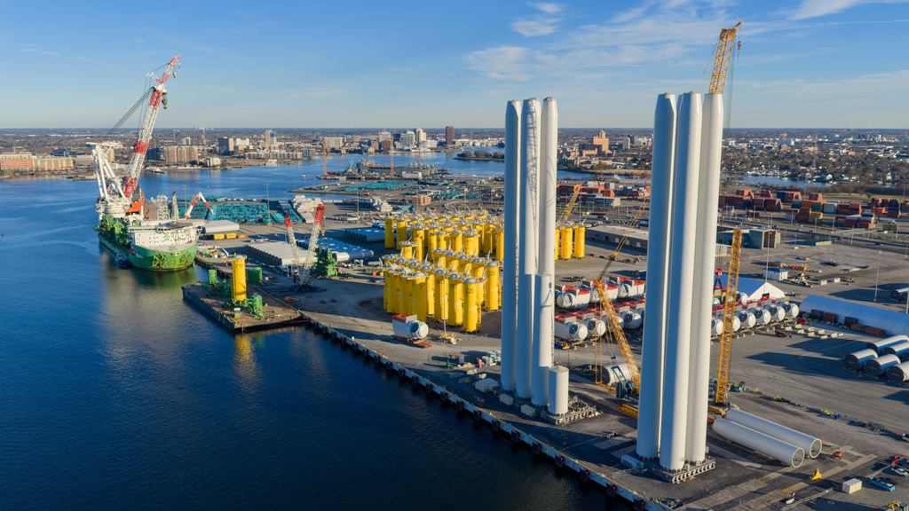 Wind turbine bases, generators and blades are positioned at The Portsmouth Marine terminal that is the staging area for Dominion Energy's wind turbine project Monday Dec. 22, 2025, in Portsmouth, Va. (AP Photo/Steve Helber)