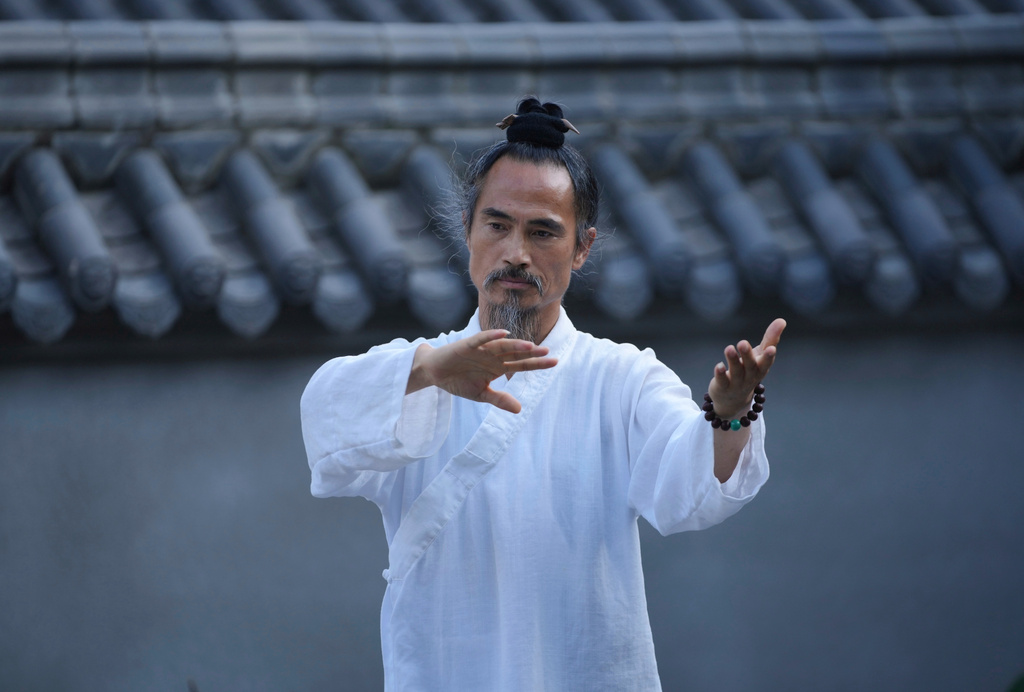 Yuan Shimao founder of Wudang Taoist Traditional Kung Fu Academy performs on the grounds of the academy near Wudang Mountain in Shiyan city in central China's Hubei province on Friday, Sept. 4, 2026. (AP Photo/Achmad Ibrahim)