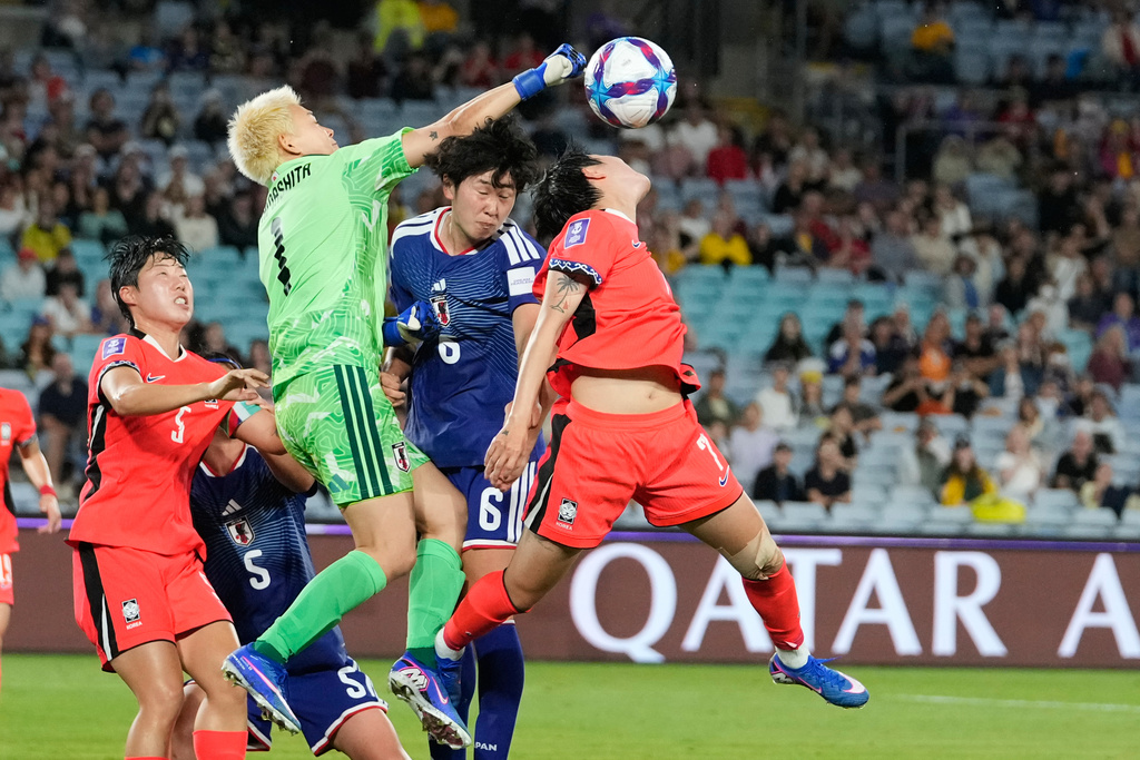 Japan's goalkeeper Ayaka Yamashita punches the ball clear of the goal during the Women's Asian Cup semifinal soccer match between Japan and South Korea in Sydney, Wednesday, March 18, 2026. (AP Photo/Rick Rycroft)