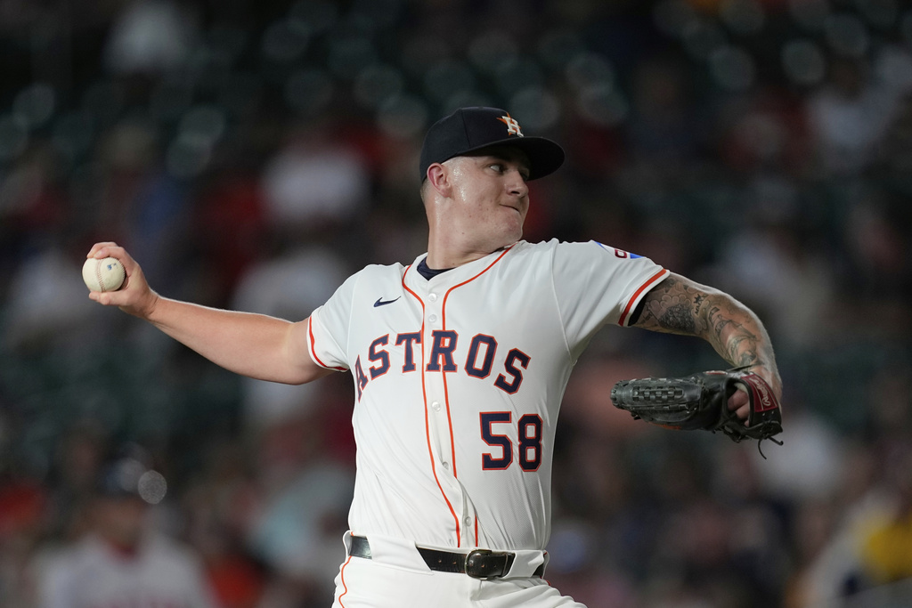 Houston Astros starting pitcher Hunter Brown throws against the Boston Red Sox during the first inning of a baseball game Wednesday, Aug. 13, 2025, in Houston. (AP Photo/David J. Phillip)