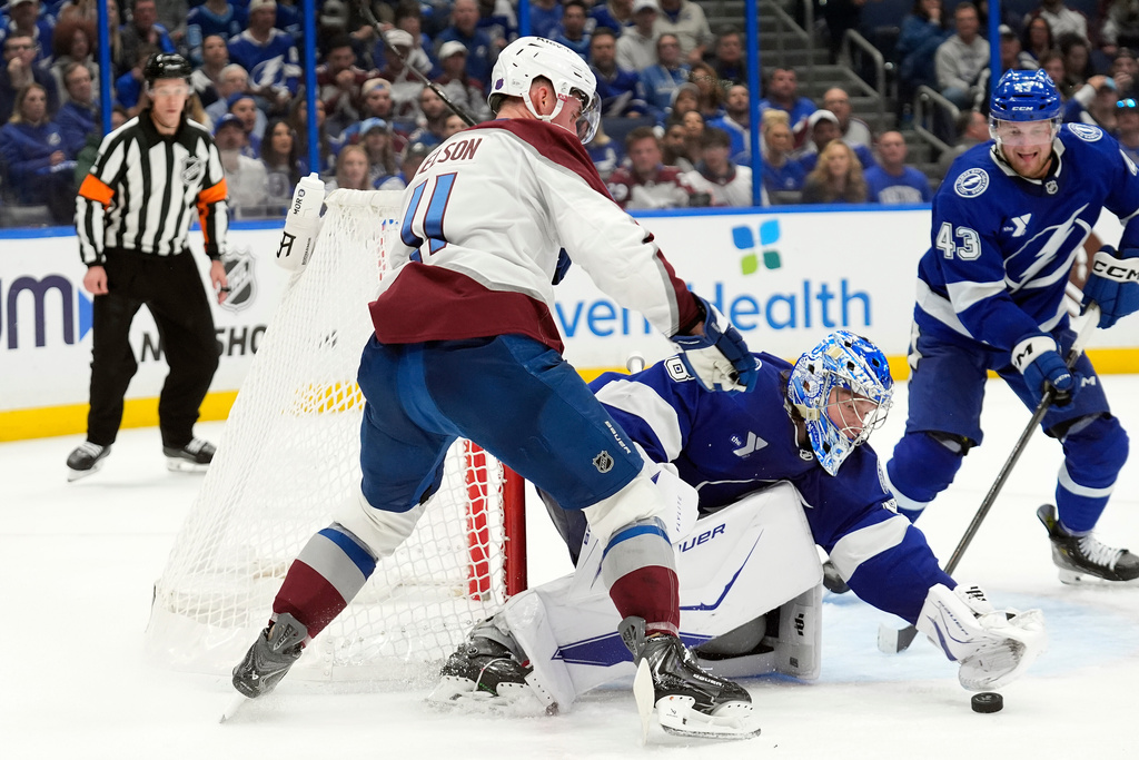 Tampa Bay Lightning goaltender Andrei Vasilevskiy (88) stops a shot by Colorado Avalanche center Brock Nelson (11) during the third period of an NHL hockey game Tuesday, Jan. 6, 2026, in Tampa, Fla. (AP Photo/Chris O'Meara)
