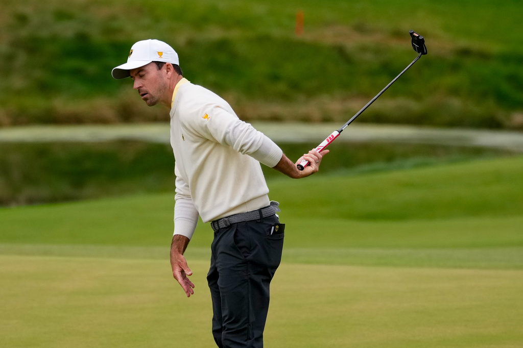 International teams' Nick Taylor, of Canada, reacts to missing his shot on the eighth green against the USA team during the Presidents Cup golf tournament second round foursomes match at Medinah Country Club, Friday, Sept. 25, 2026, in Medinah, Ill. (AP Photo/Chris Carlson)