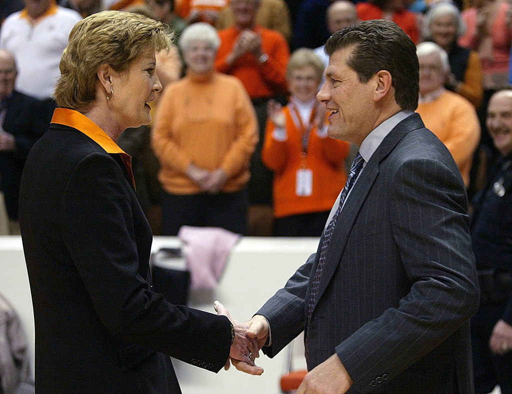 FILE - Tennessee coach Pat Summitt, left, shakes hand with Connecticut coach Geno Auriemma before a women's college basketball game, Jan. 7, 2006, in Knoxville, Tenn. (AP Photo/Wade Payne, File)