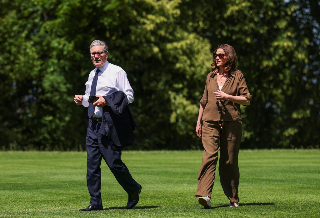 Britain's Prime Minister Keir Starmer arrives with his wife Victoria Starmer ahead of the G7 Summit, held in France's Evian-les-Bains, in Geneva, Switzerland, Monday June 15, 2026. (Isabel Infantes, Pool Photo via AP)
