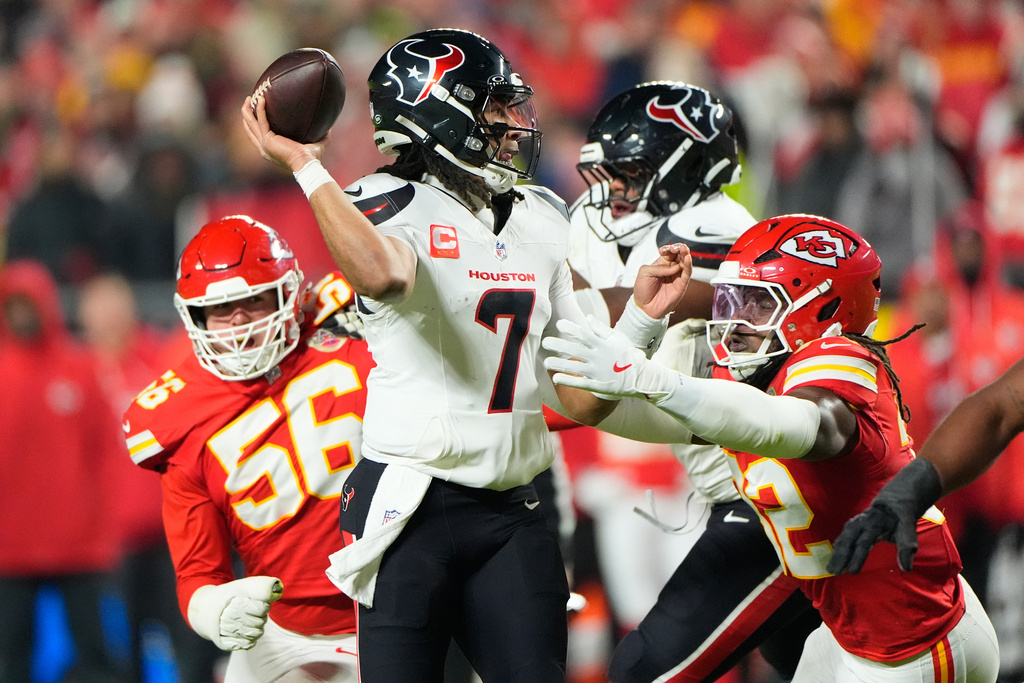 Houston Texans quarterback C.J. Stroud (7) throws a touchdown pass during the first half of an NFL football game against the Kansas City Chiefs Sunday, Dec. 7, 2025, in Kansas City, Mo. (AP Photo/Charlie Riedel)