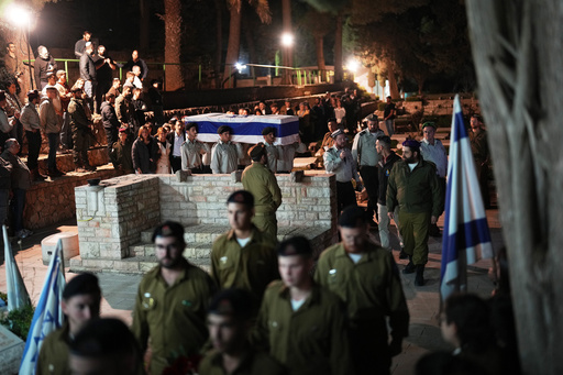 Israeli soldiers carry the coffin of slain hostage Captain Daniel Peretz during his funeral at Mt. Herzl military cemetery in Jerusalem, Wednesday, Oct. 15, 2025. Peretz's body was returned from Gaza to Israel as part of a ceasefire agreement between Israel and Hamas. (AP Photo/Francisco Seco) Israeli soldiers carry the coffin of slain hostage Captain Daniel Peretz during his funeral at Mt. Herzl military cemetery in Jerusalem, Wednesday, Oct. 15, 2025. Peretz's body was returned from Gaza to Israel as part of a ceasefire agreement between Israel and Hamas. (AP Photo/Francisco Seco)