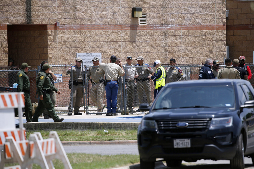 FILE - Law enforcement, and other first responders, gather outside Robb Elementary School following a shooting in Uvalde, Texas, on May 24, 2022. (AP Photo/Dario Lopez-Mills, File)