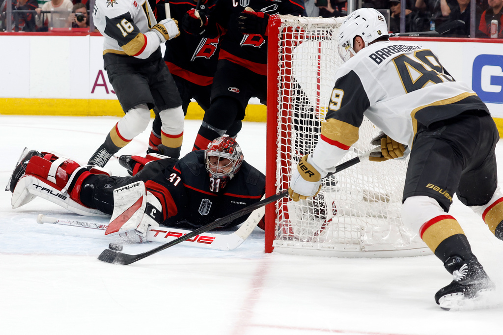 Carolina Hurricanes goaltender Frederik Andersen (31) stops a shot byf Vegas Golden Knights' Ivan Barbashev (49) during the third period in Game 2 of the NHL hockey Stanley Cup Final series in Raleigh, N.C., Thursday, June 4, 2026. (AP Photo/Karl DeBlaker)