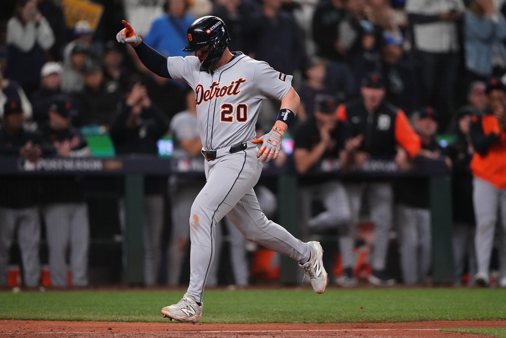Detroit Tigers' Spencer Torkelson runs home to score the go-ahead run off of a single hit by Zach McKinstry during the 11th inning in Game 1 of baseball's American League Division Series against the Seattle Mariners, Saturday, Oct. 4, 2025, in Seattle. (AP Photo/Lindsey Wasson)