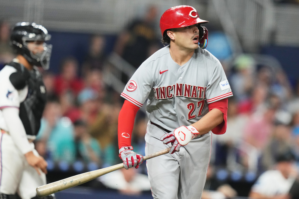 Cincinnati Reds' Sal Stewart watches after hitting a sacrifice fly to score Matt McLain during the ninth inning of a baseball game against the Miami Marlins, Tuesday, April 7, 2026, in Miami. (AP Photo/Lynne Sladky)