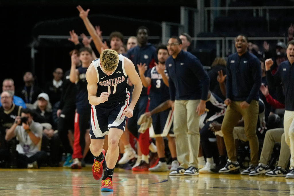 Gonzaga guard Mario Saint-Supery (17) reacts after making a 3-point basket against San Francisco during the second half of an NCAA college basketball game in San Francisco, Wednesday, Feb. 18, 2026. (AP Photo/Jeff Chiu)
