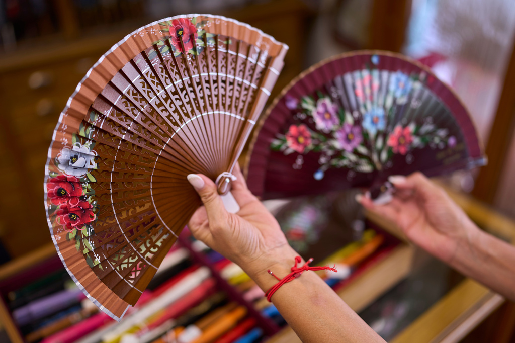 Fans are displayed at Casa Diego, a fan shop in Madrid, Spain, on Aug. 18, 2026. (AP Photo/Manu Fernandez)