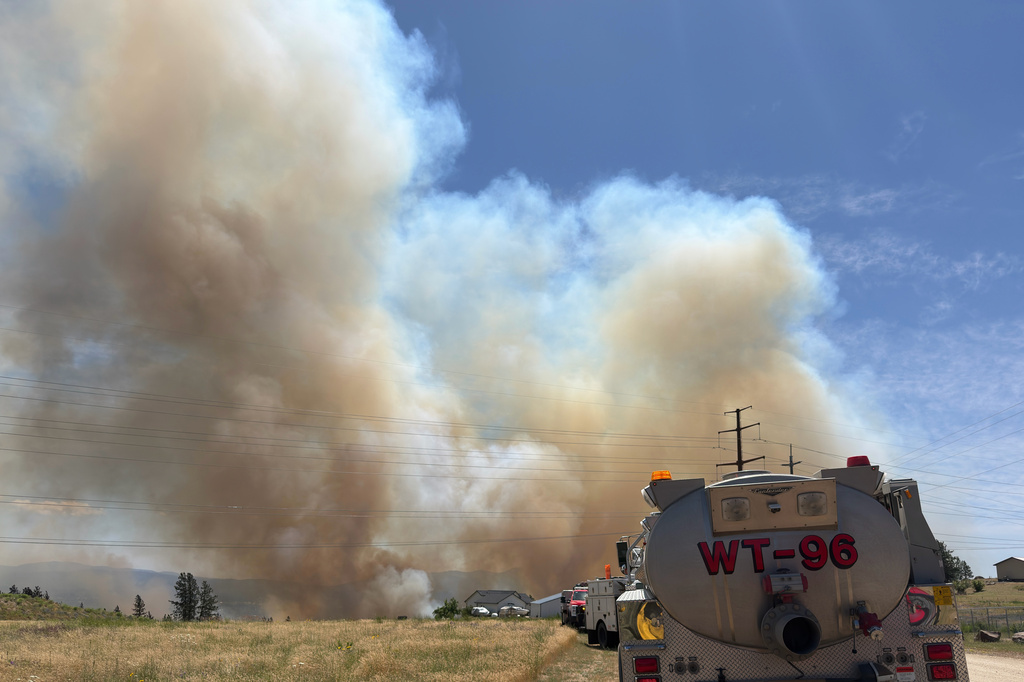 This photo provided by Spokane Fire District 9 shows smoke rising from the Upriver Fire burning northeast of Spokane, Wash., on Tuesday, June 16, 2026. (Robert Gray/Spokane Fire District 9 via AP)