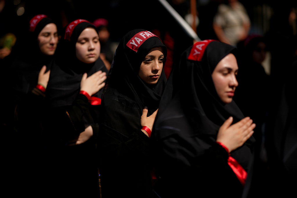 Shiite faithful Muslims attend an Ashoura procession which commemorates the 7th-century martyrdom of Imam Hussein in Istanbul, Turkey, Thursday, June 25, 2026. (AP Photo/Emrah Gurel)