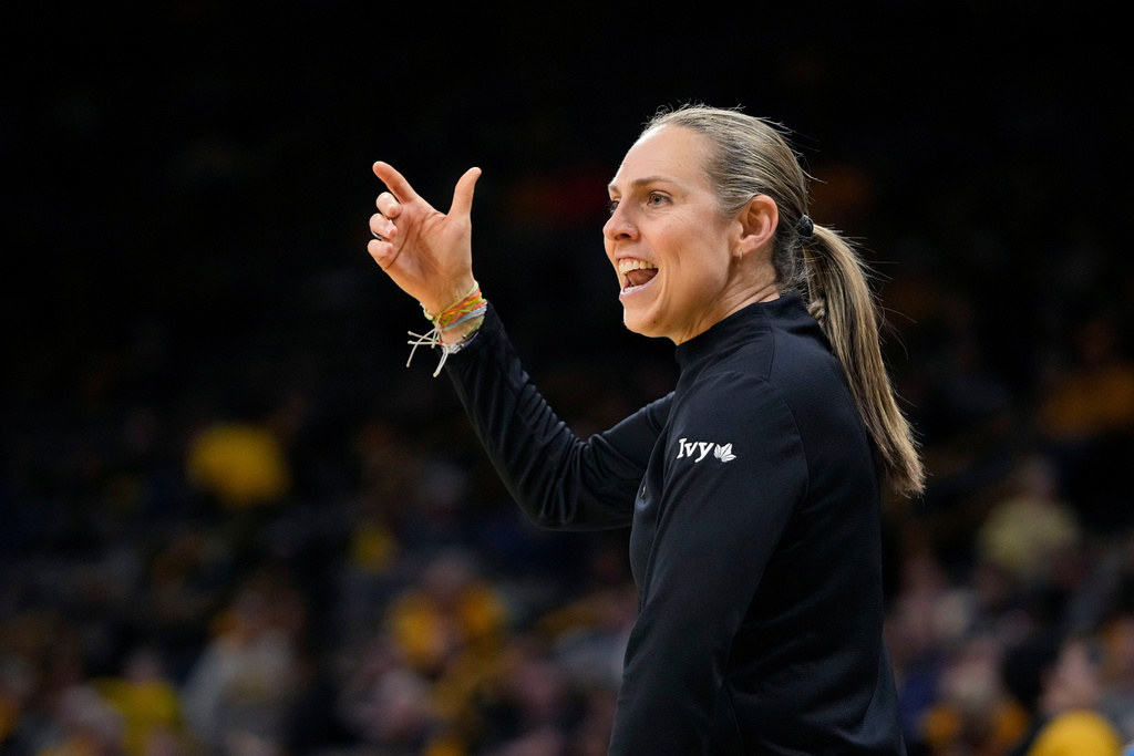FILE - Princeton head coach Carla Berube directs her players against West Virginia in the first half of a first-round college basketball game in the NCAA Tournament, March 23, 2024, in Iowa City, Iowa. (AP Photo/Matthew Putney, File)