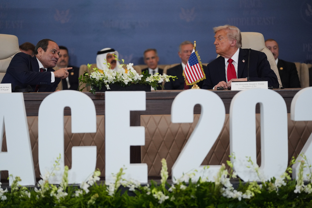 President Donald Trump and Egypt's President Abdel-Fattah el-Sissi talk during a summit to support ending the more than two-year Israel-Hamas war in Gaza after a breakthrough ceasefire deal, Monday, Oct. 13, 2025, in Sharm El Sheikh, Egypt. (AP Photo/Evan Vucci)